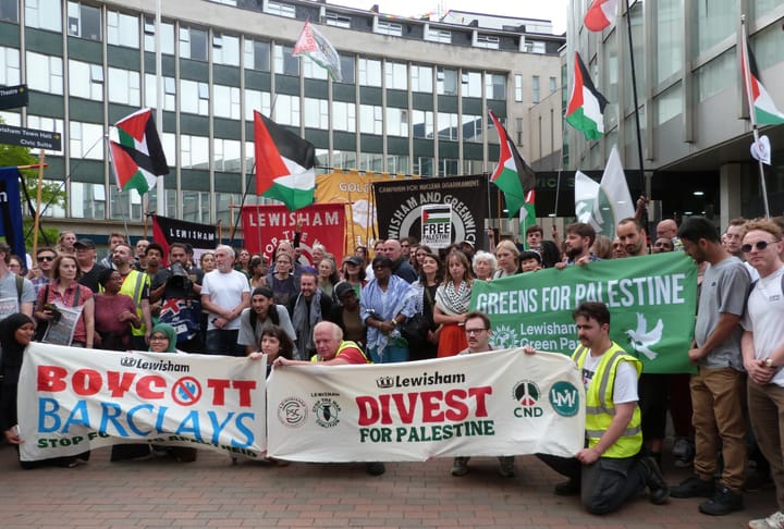 Campaigners with banners: Lewisham divest for Palestine, Lewisham Boycott Barclays, Greens for Palestine
