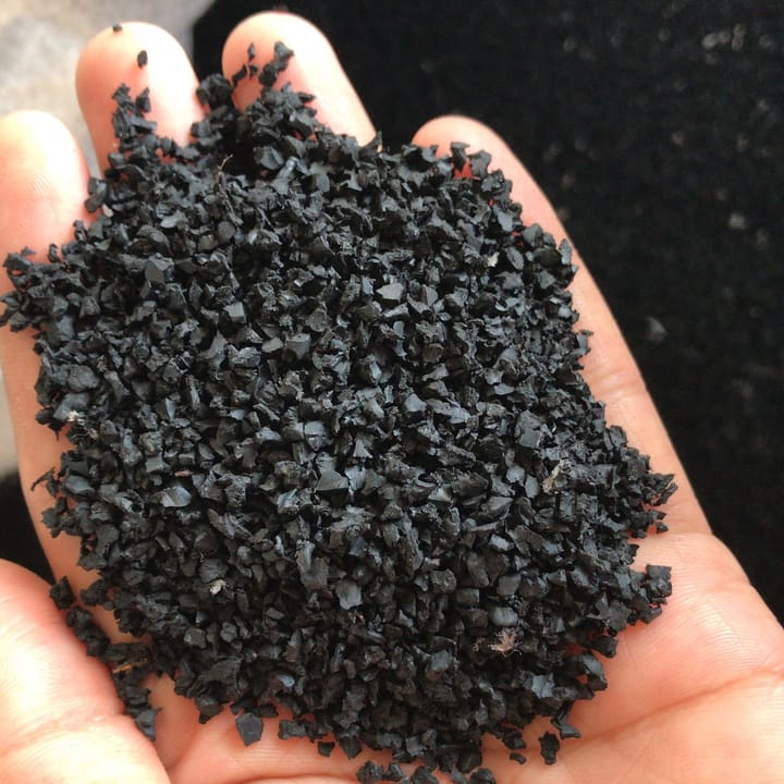 Picture of open palm showing handful of rubber crumb. Caption - 3G football pitches use around 120 tons of rubber crumb, topped up with 300 kg/year